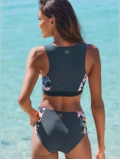Bas de maillot de bain coloris uni tendance avec empiècements imprimés sur les côtés