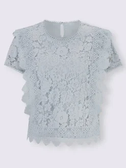 Chemisier en coton avec différents motifs de dentelle
