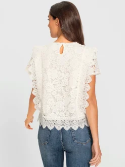 Chemisier en coton avec différents motifs de dentelle