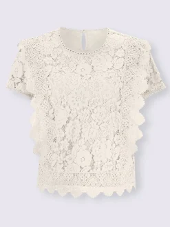 Chemisier en coton avec différents motifs de dentelle
