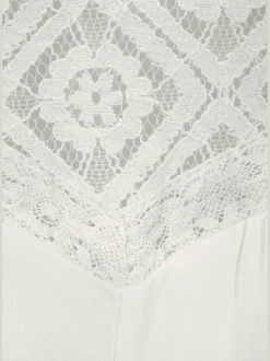 Haut de plage empiècement dentelle transparent aux épaules