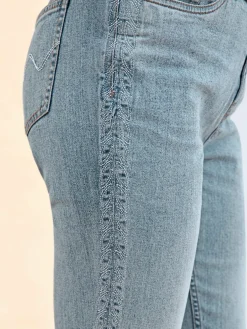 Jean 5 poches broderie le long des coutures latérales