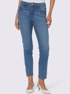 Jean push-up avec œillets et chaînes décoratives
