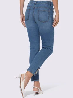 Jean push-up avec œillets et chaînes décoratives