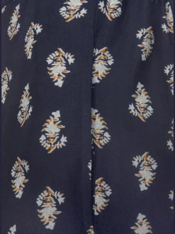 Pantalon ceinture plate devant, élastique derrière
