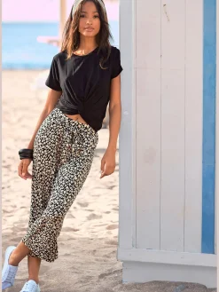 Pantalon large pantalon en tissu léger avec imprimé sur toute la surface