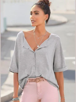 Pull à manches courtes patte de boutonnage au dos