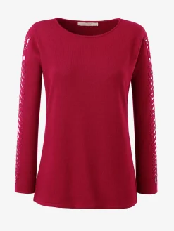 Pull manches originales laissant entrevoir les bras