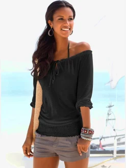 Se porte comme un t-shirt carmen ou sur les épaules