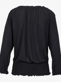 Se porte comme un t-shirt carmen ou sur les épaules