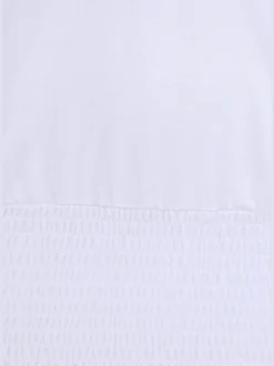 Se porte comme un t-shirt carmen ou sur les épaules