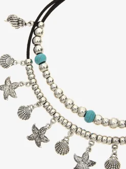 Superbe chaîne de cheville avec pendentifs