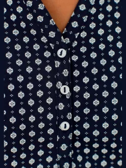 T-shirt patte de boutonnage avec boutons légèrement brillants