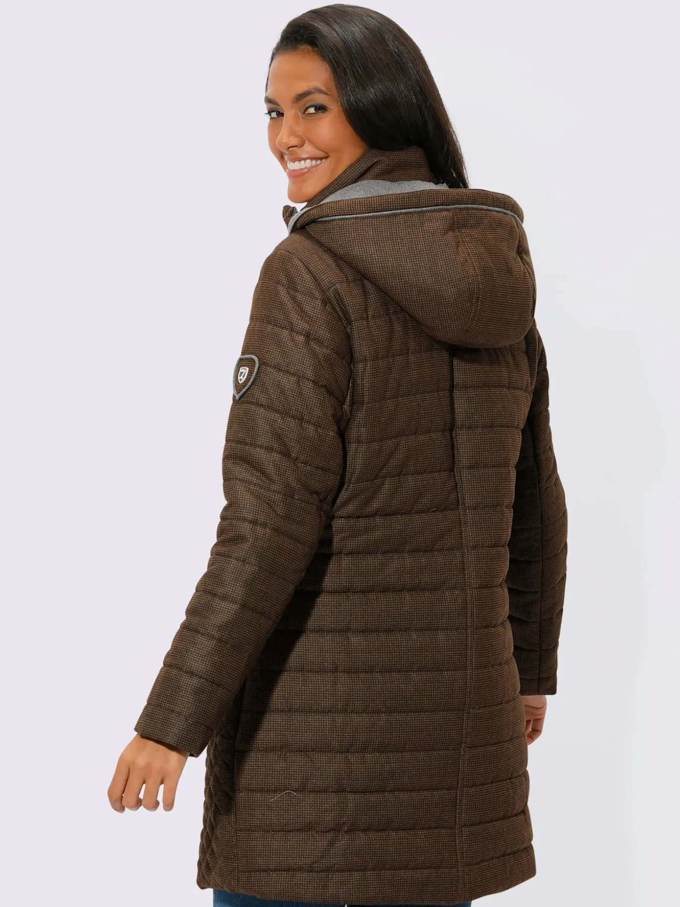 Veste longue capuche amovible grâce à une glissière